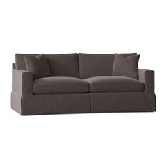 an image of a couch with pillows on the top and bottom half, in grey fabric