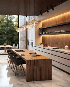 a modern kitchen with wooden cabinets and counter tops, along with black leather dining chairs