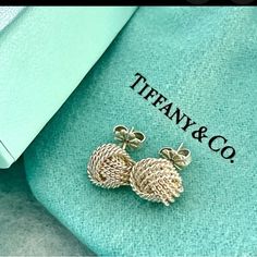 Tiffany & Co Knot Earrings In Silver. Comes With Dust Bag And Box. Box A Little Water Stained. Earrings Will Be Cleaned And Polished At Tiffany’s Prior To Shipping. Jewelry Tiffany, Knot Earrings, Tiffany Co Jewelry, Water Stains, Earrings Color, Tiffany & Co., Knot, Dust Bag, Jewelry Earrings