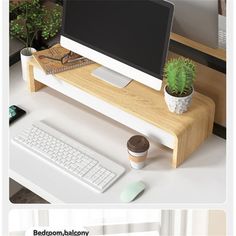 a computer monitor sitting on top of a wooden desk next to a keyboard and mouse