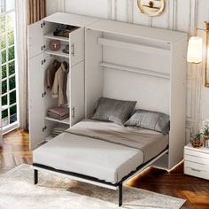 a white bed with a pull out closet underneath it