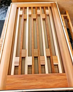 a wooden bed frame sitting on top of a floor