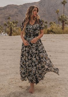 Boho Black & Yellow Floral Maxi Dress | LOVESTITCH Breezy Flowy Maxi Dress With Short Sleeves, Flowy Short Sleeve Maxi Dress In Breezy Style, Flowy Breezy Maxi Dress With Short Sleeves, Flowy Breezy Short Sleeve Maxi Dress, Flowy Maxi Dress With Short Sleeves For Summer, Spring Breezy Short Sleeve Maxi Dress, Modest Floral Print Maxi Dress For Vacation, Flowy Short Sleeve Maxi Dress For Spring, Bohemian Maxi Dress With Flowy Skirt And Short Sleeves