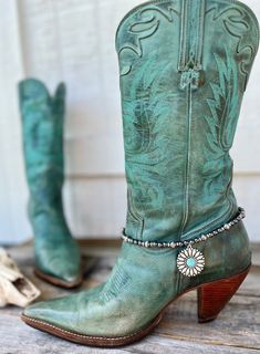 Introducing our stunning "Turquoise Sunflower" Cowgirl Boot Bracelet, a perfect accessory for cowboy boots. This handmade cowgirl boot bracelet features imitation Navajo pearls and a mesmerizing synthetic turquoise and silver pendant, making it a true testament to the allure of Western and Native American-inspired jewelry.  👢 Faux Navajo Pearls  👢 Adjustable boot bracelet measuring 16 inches (13 inches for the design plus 3 inch extender chain). Will fit boots with a shaft circumference betwee Sunflower Cowgirl Boots, Turquoise Sunflower, Pearl Boots, Cowboy Jewelry, Turquoise Boots, Boot Chains, Cowgirl Accessories, Turquoise Western, Boot Bracelet