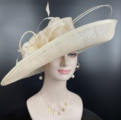 "https://www.youtube.com/shorts/0SWUprbeWfw With my little son's help, I finished the video on Youtube, it is very hard for the people to get a right size hat due to the big head size, please check the video, it will help you.  Description: This beautiful sinamay hat is an elegant wear at any church or derby event. its sinamay material is not too intimidating and attracts the eye. The chic flower adnorment that rests on the wide, side sweep brim is complemented by sinamay accentuations. Material: Sinamay with feathers Crown Width; 8 inch Crown Height: 4 inch Brim Width: 18 inches Head girth is from 22' to 23.22 \" adjustable size fits  most with an adjustable cord strap for the smaller fit If you need to  some colors on the hat to match your dress, please let me know Color on screen may va Formal Sinamay Brimmed Boater Hat, Elegant Beige Spring Fascinator, Formal High Crown Fascinator For Kentucky Derby, Classic Formal Fascinator For Royal Ascot, Church Fascinator With Short Brim In Sinamay, Sinamay Fascinator With Short Brim For Church, Classic Mini Hats For Summer Wedding, Church Sinamay Fascinator With Short Brim, Beige Curved Brim Fascinator For Formal Events