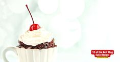 there is a cupcake with whipped cream and a cherry on top in the photo