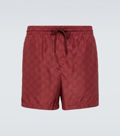 GG swim trunks in burgundy - Gucci | Mytheresa Casual Gucci Bottoms With Elastic Waistband, Short Gucci Bottoms For Summer, Gucci Swimwear For Summer, Gucci Beachwear Swimwear For Summer, Gucci Beachwear For Summer, Nylon Swim Trunks With Side Pockets, Nylon Pool Shorts With Functional Drawstring, Swag Men, Gucci Outfits