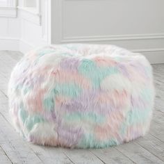 a multicolored bean bag sits on the floor