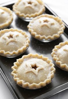 six pies sitting on top of a baking pan