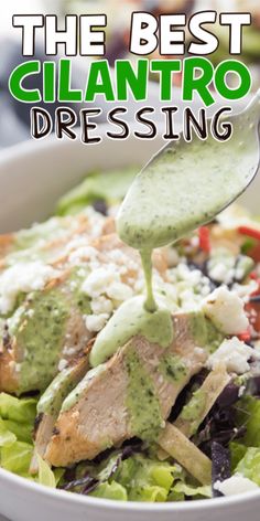 the best cilantro dressing is being drizzled over a salad in a white bowl