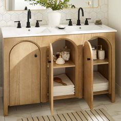 a bathroom vanity with two sinks and mirrors above it is decorated in white hexagonal tiles