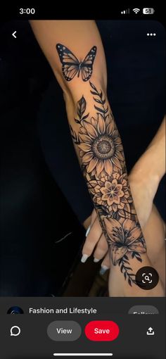 a woman's arm with sunflowers and butterflies on it