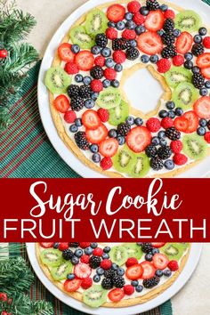 a cake with fruit on top and the words sugar cookie fruit wreath overlaying it