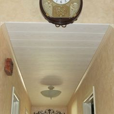 a hallway with a clock on the wall