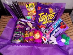 a purple bag filled with lots of candy