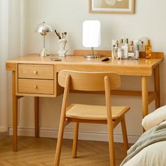 a bedroom with a desk and chair in it