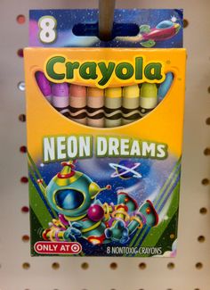 a box of crayola neon dreams is hanging on the wall in a store