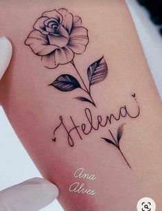 a woman's arm with a rose tattoo on it and the words hello written in cursive writing