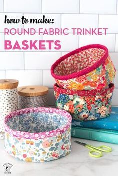 three baskets are sitting next to each other on a counter with the words how to make round fabric trinket baskets