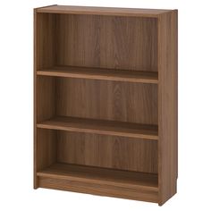 a wooden bookcase with three shelves