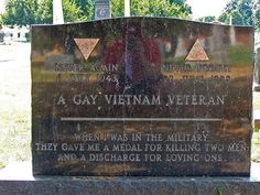 a memorial marker in the middle of a cemetery