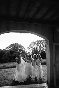 the bridesmaids are getting ready to walk down the aisle