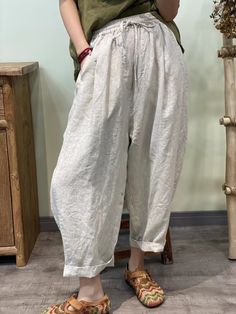 Stay cool and stylish in our Summer Solid 100% Linen Harem Pants. Crafted from breathable linen fabric, these pants offer a relaxed fit and effortless summer style. Perfect for casual outings or lounging at home, their versatile design ensures comfort without compromising on fashion. Spring Summer Harem Pants With Pockets, Spring/summer Harem Pants With Pockets, Casual Baggy Harem Pants For Vacation, Casual Baggy Pants For Summer, Baggy Casual Harem Pants For Vacation, Baggy Casual Summer Pants, Summer Solid Color Relaxed Fit Harem Pants, Comfortable Solid Color Spring Harem Pants, Comfortable Solid Color Harem Pants For Spring