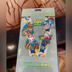 the toy story pixar pins are in their packaging