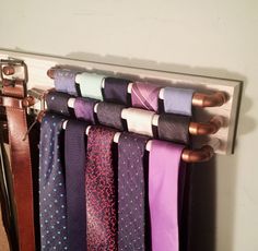 a rack with ties hanging from it's hooks