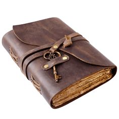 a brown leather book with a key on the front cover and an old - fashioned lock in the middle