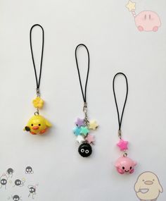 three different necklaces with cartoon characters on them