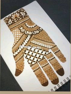 a drawing of a hand with intricate designs on it