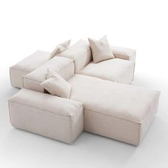 a white couch with pillows on top of it