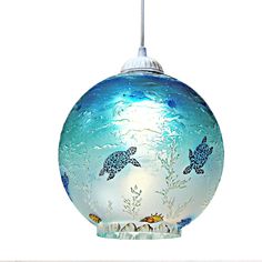 a blue glass ornament with sea animals on it