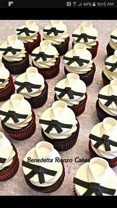 cupcakes decorated with black ribbon and bow ties