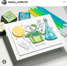 some crafting supplies are laying out on a table with markers and pencils next to them