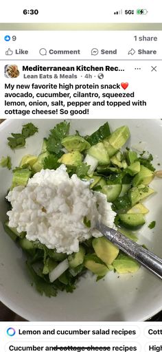 a white plate topped with cucumber and cottage cheese