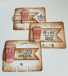 three coasters that have coffee signs on them