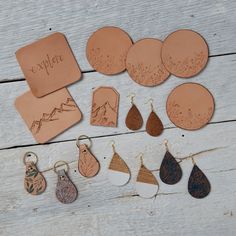 leather earrings and earring gift set displayed on wooden table with notepads, tags and envelope