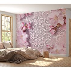 a bedroom with pink flowers on the wall