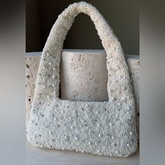 Elevate Your Style With This Stunning Modern Pearl Handbag. This Bag Is Entirely Covered With Intricately Placed Pearls And Unique Crystal Detailing Embellishments. This Bag Is So Versatile With Sophistication And Elegance, Perfect For A Bride, Cocktail Party Or Add Luxury To Your Everyday Casual Look. Top Zipper Closure Size: From Top Of Strap To Bottom Of Purse 12.5 In Across 9.5 In Bride, Mom, Makeup, Cosmetics, Cosmetic Bag, Mother, Nana, Baby, Kids, Gift For Her, Bridal Gift, Travel Bag, Tr Bride Handbag For Wedding Day, Elegant Evening Cream Baguette Bag, White Handheld Baguette Bag For Evening, Cream Rectangular Evening Baguette Bag, Cream Rectangular Baguette Bag For Evening, Rectangular Cream Baguette Bag For Evening, White Bags With Pearl Handle For Shopping, Elegant White Handheld Baguette Bag, White Shopping Bag With Pearl Handle