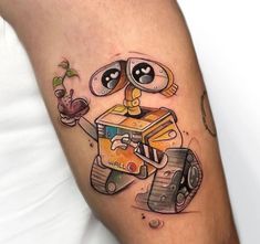 a man with a tattoo on his arm that has a cartoon character holding a book