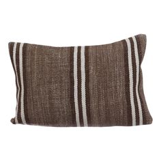 a brown and white striped pillow on a white background