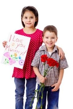 two children holding flowers and a sign that says i love you mum