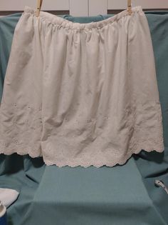 Channel your inner cottagecore fairy in this lovely little cotton number. In excellent condition with no rips, tears, or stains, this gorgeous skirt is too pretty to be forgotten. The tag is illegible, but the zipper action is smooth and easy. No size is indicated but this skirt measures 17 inches across at the waist. Snap this up before it's gone! This item is sold "as is" and as pictured. Cottagecore Vintage, Eyelet Skirt, Cottagecore Fairy, White Vintage, Halloween Shopping, Paisley, Art Collection, Womens Skirt, Bathing Beauties