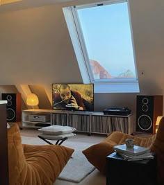 a living room filled with furniture and a flat screen tv on top of a wall