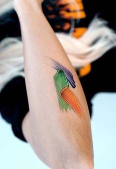 a woman with a colorful tattoo on her arm