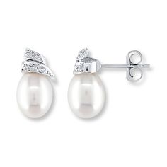 Lustrous baroque-shaped cultured pearls are crowned with swirls dotted with sparkling diamond accents in these lovely earrings for her. Fashioned in 14K white gold, the earrings secure with friction backs. Elegant Pear-shaped Pearl Earrings For Anniversary, Pearl Diamond Earrings For Anniversary, Pear-shaped Diamond Earrings For Formal Occasions, White Gold Pear-shaped Pearl Earrings, Elegant White Pear-shaped Diamond Earrings, Evening Pearl Earrings In Diamond White, Elegant Pear-shaped Pearl Earrings With Diamond Accents, Diamond White Pearl Earrings For Evening, White Pearl Earrings With Diamond Accents For Anniversary