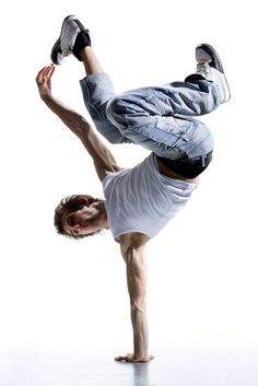 a man doing a handstand on his skateboard in front of a white background