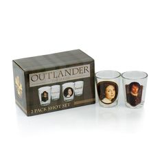 two shot glasses in front of a box with the image of queen elizabeth and prince edward